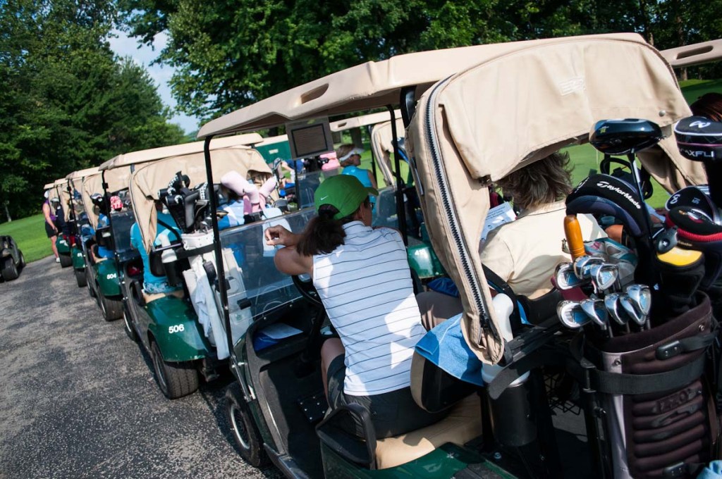 line of golf carts ready for event